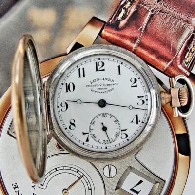 Longines double-lid silver pocket watch from the early 1900s.