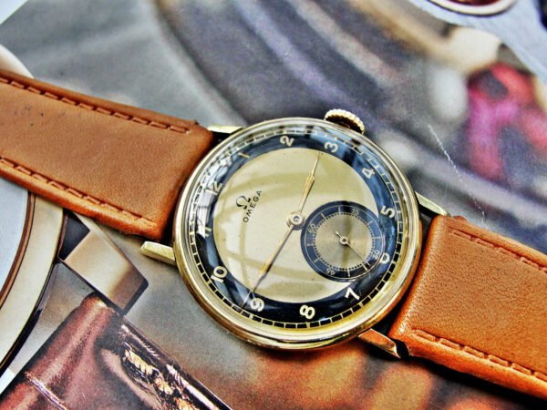Beautiful bicolor dial 14-carat gold Omega watch from the 1940s.