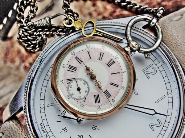 Rare silver pocket watch with key from the 1800s.