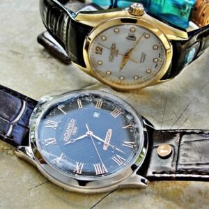 Two Swiss Roamer watches with box and paper.