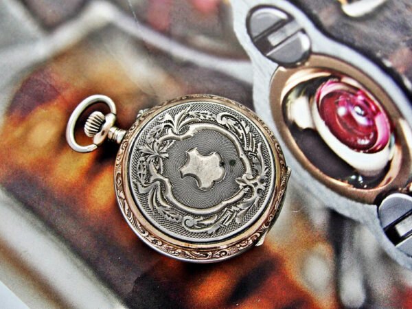 Silver nun watch with double lid porcelain dial.