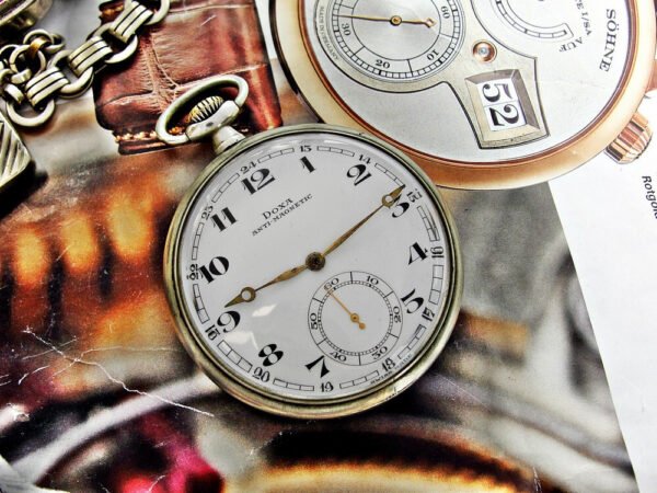 Nice Doxa pocket watch with metal holder from the 1920s - Image 15