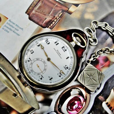 Nice Doxa pocket watch with metal holder from the 1920s
