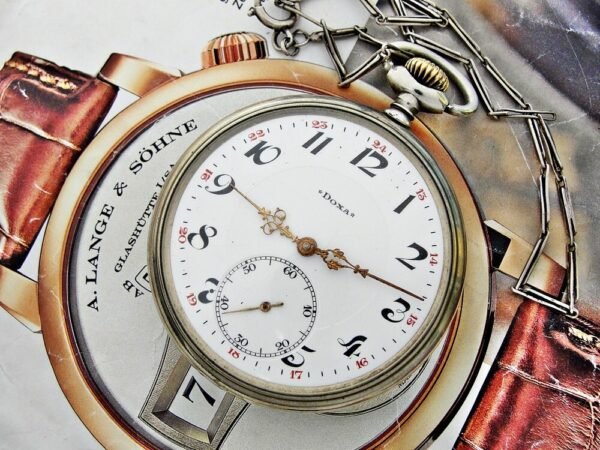 Nice Doxa pocket watch with porcelain dial and nice chain from the 1920 - Image 18