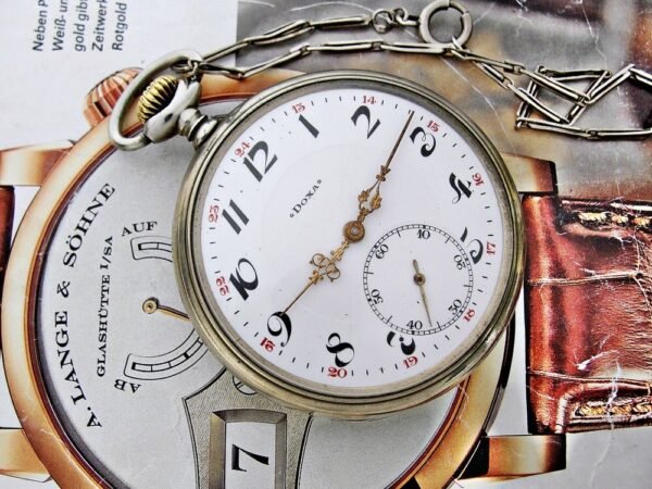 Nice Doxa pocket watch with porcelain dial and nice chain from the 1920
